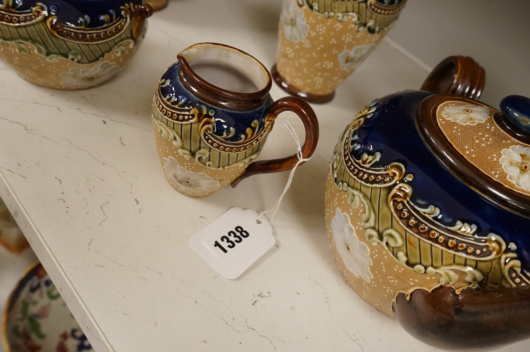A group of French faience pottery to include spill vases, an ink well and dishes, largest 21cm high